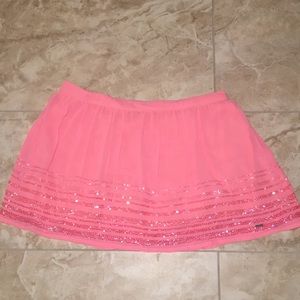 Coral colored mini skirt